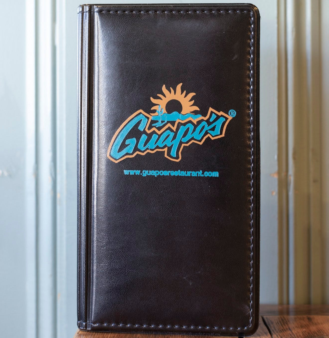 padded check presenter with custom blue logo