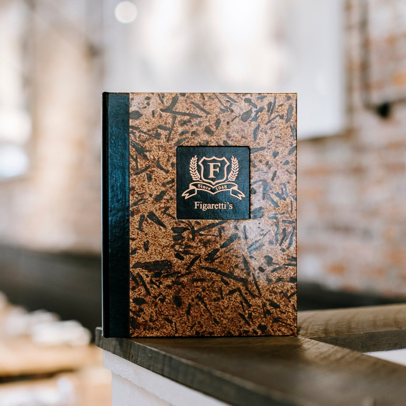 distressed patina copper menu cover with monticello window cut out and foil stamped logo