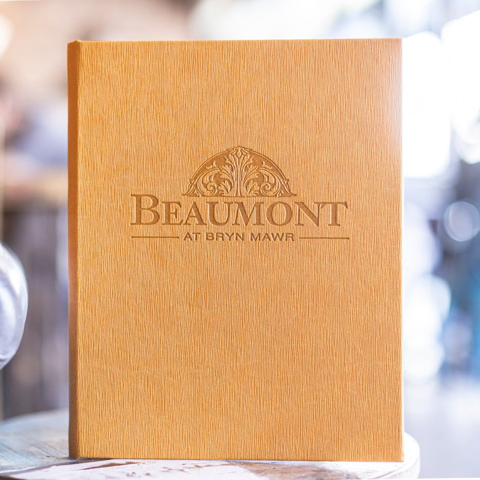 Vienna marigold carded menu with "Beaumont" logo blind debossed